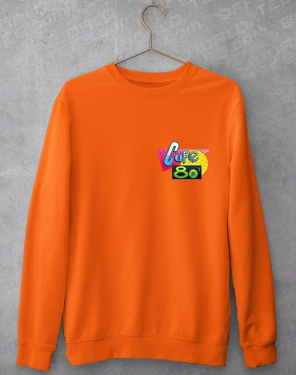 Cafe 80s Pocket Print Sweatshirt S / Orange Crush  - Off World Tees
